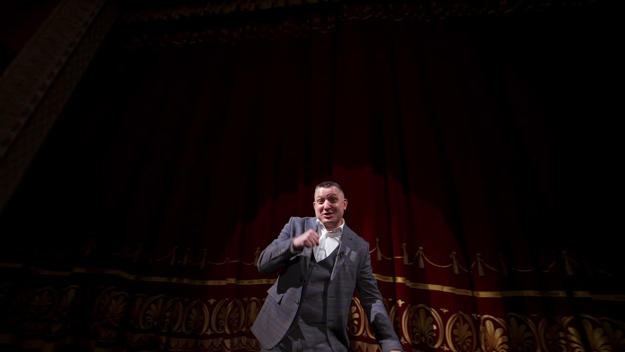 Inspirational male speaker does presentation of new technological product. Motivational Speaker.