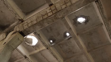 a bombedout building in ukraine rocket holes in the ceiling
