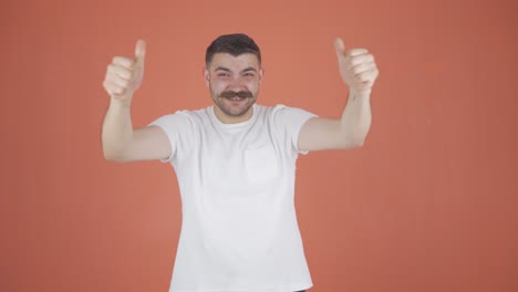 man clapping excitedly to camera.