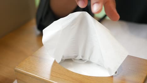taking tissue from box