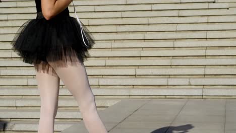 female ballet dancer listening music on mobile phone 4k