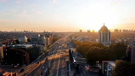 stunning sunrise over the city with traffic on the street