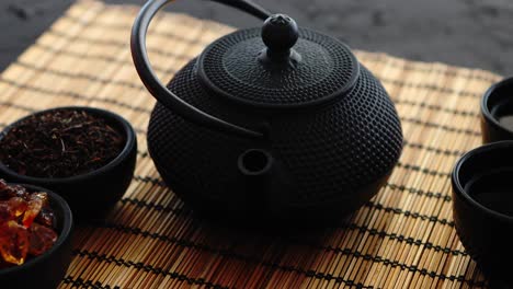 asian green tea set on bamboo mat