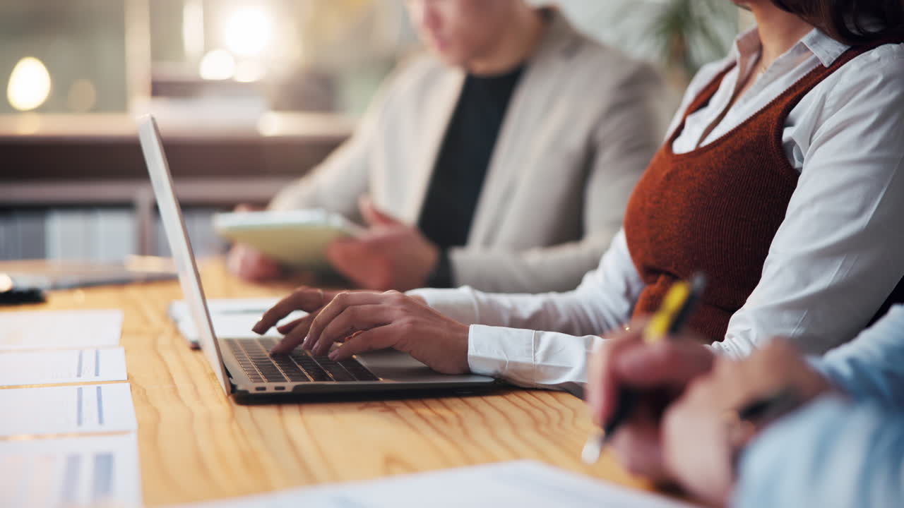 Business meeting with laptops and documents