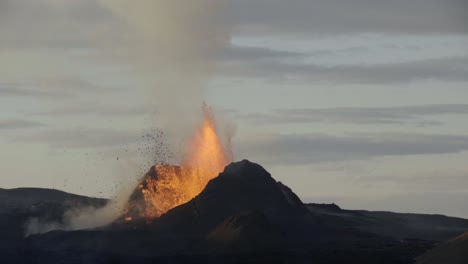 powerful eruption from volcano crater iceland day