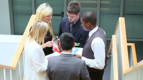 business people talking in corridor footage