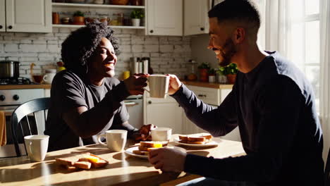 a couple having breakfast together in the kitchen