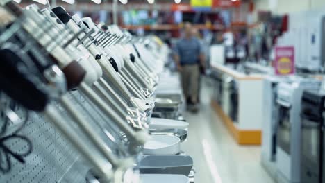 people stroll in the department of consumer electronics 2