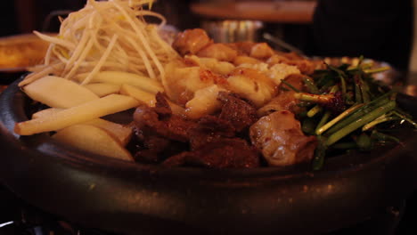 korean bbq hot pot with vegetables and meat