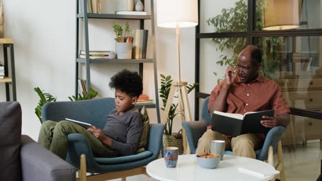 black man and boy in the living room