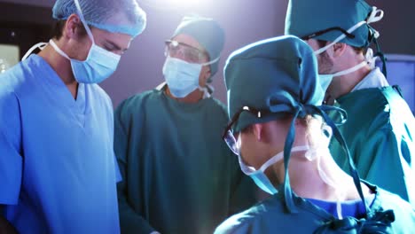 medical team performing operation in operating room