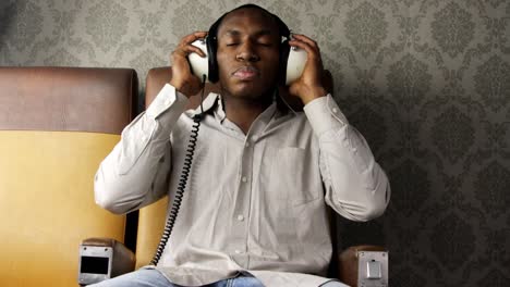 man putting on headphones 02