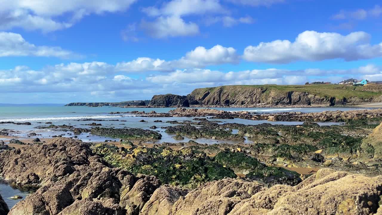 Ireland Epic Coastlines low spring tide revealing golden rocks and stunning view Copper Coast Waterford on a beautiful morning