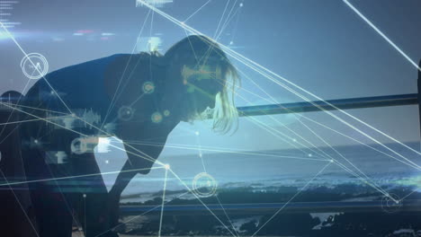exercising by ocean, person with digital network animation overlay in silhouette