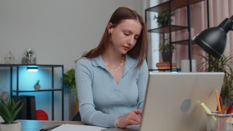 Young-woman-freelancer-at-home-office-pray-to-God-ask-for-good-luck-in-business-startup-negotiations