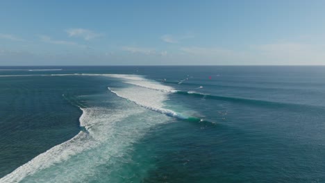 kitesurfers and surfers riding the one eye reef in mauritius