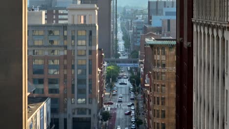 Tight-long-aerial-of-skyscraper-tower-buildings-in-golden-hour-light