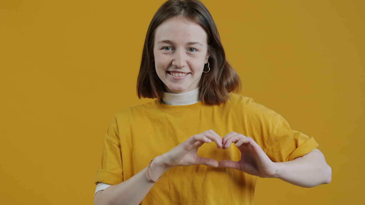 Woman Making Heart Shape Gesture