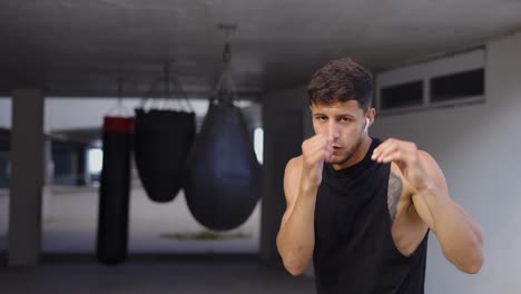 Martial-art-fighter-does-shadow-boxing-to-the-camera