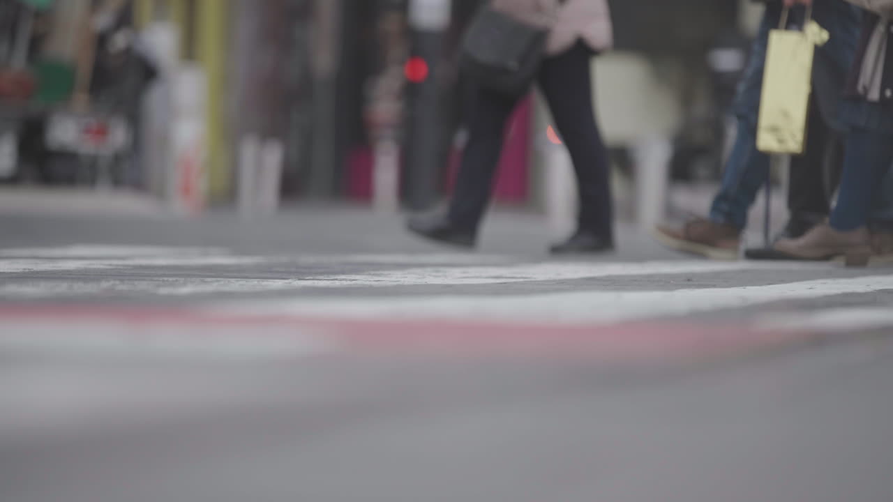 Pedestrians Crossing a City Street