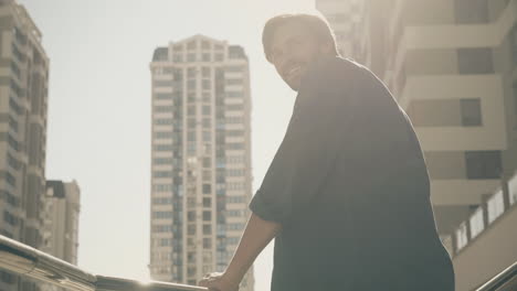 smiling man in city
