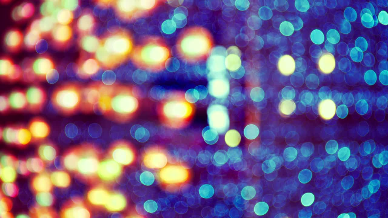 Blurred light spots seamless loop circle color bokeh lights background