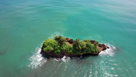 small tropical island rock in waters of pacific ocean near costa rica