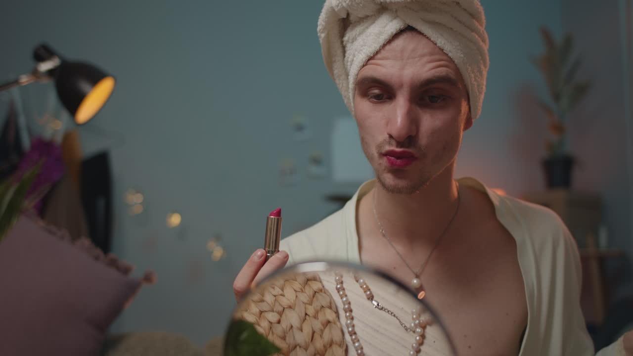 Man Applying Lipstick in Mirror