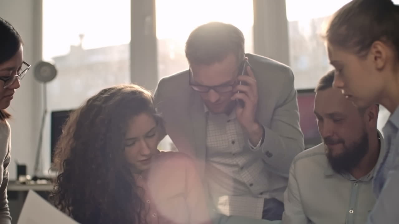 Excited Business Team Receiving Excellent Business Idea By Phone