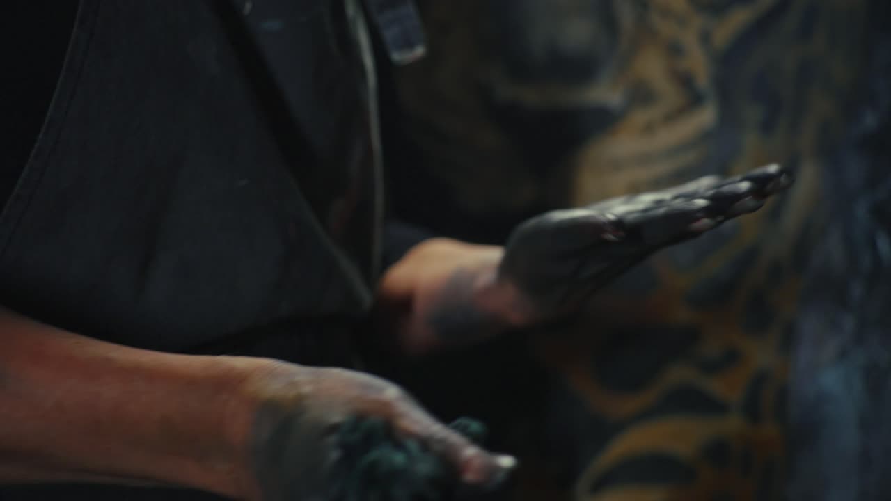 Artist's Hands Working with Paint