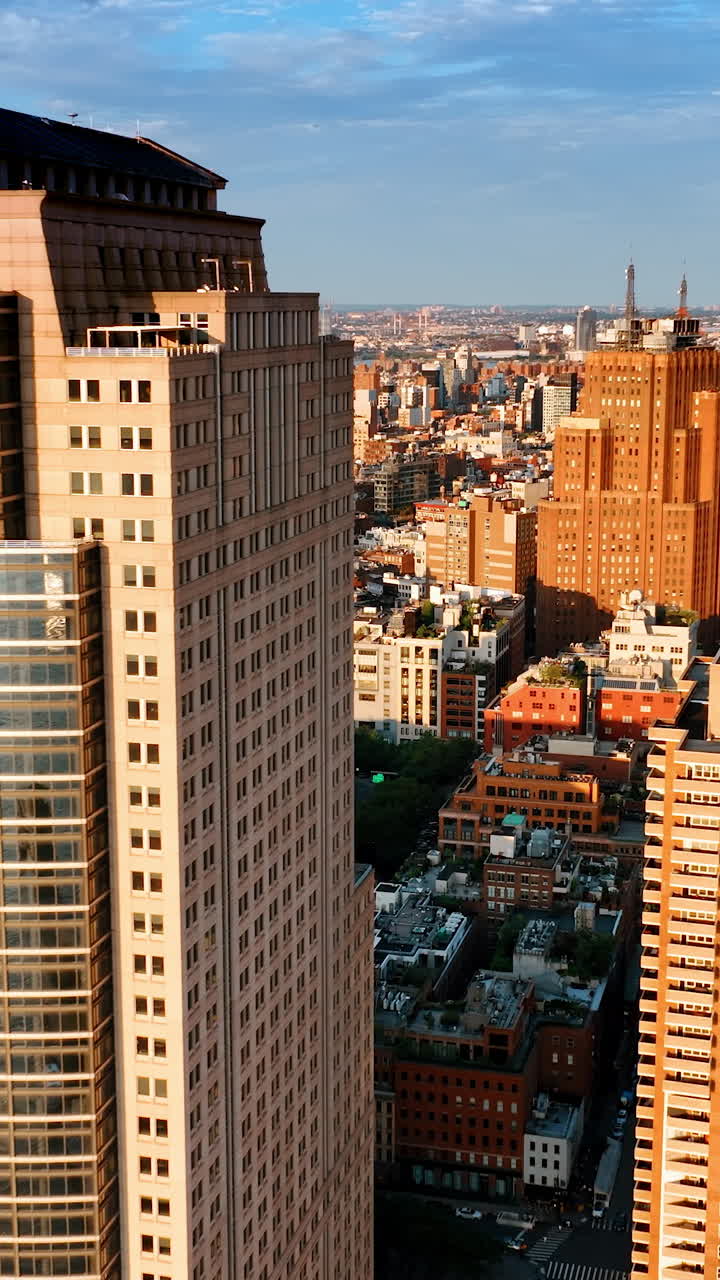 Wonderful sunlit cityscape of New York in the morning. Diverse architecture in the metropolis panorama. Top view. Vertical video