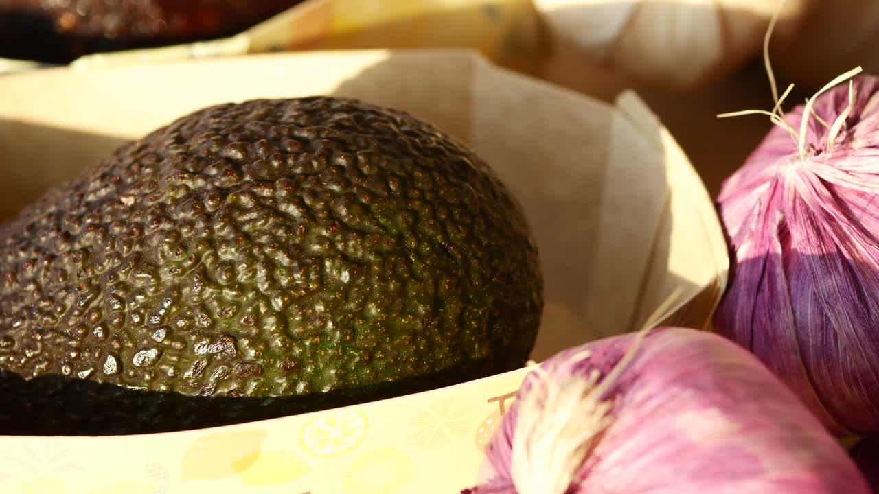 Avocado and Garlic at a Farmers Market