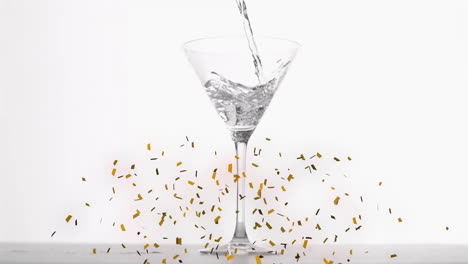 animation of confetti over glass of wine on white background