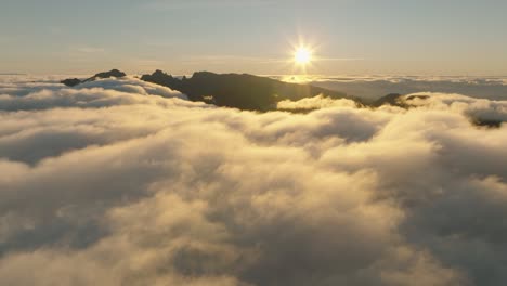 Drone-flight-over-the-clouds-during-a-sunrise-in-Madeira-Portugal