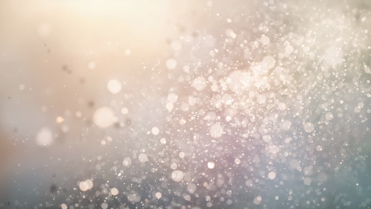 Eine fortschreitende Sequenz zeigt schwebende Partikel und Bokeh-Scheiben, die im Studio treiben, mit warmem und kühlem Glanz.