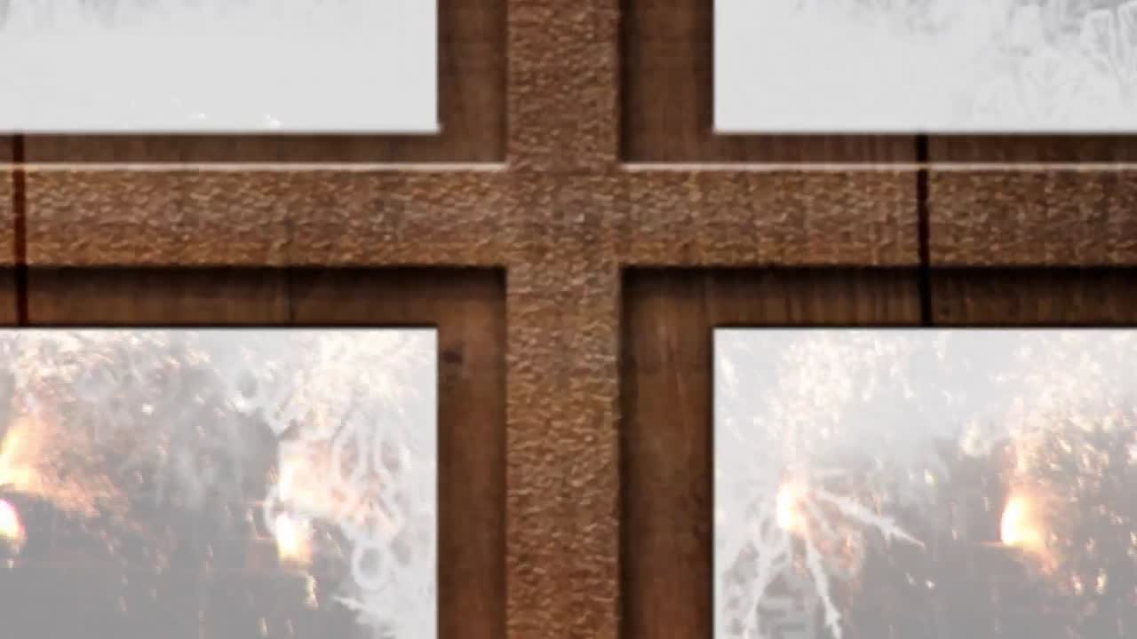 검은 바탕에 떨어지는 빛의 불꽃 위에 나무 창문 프레임