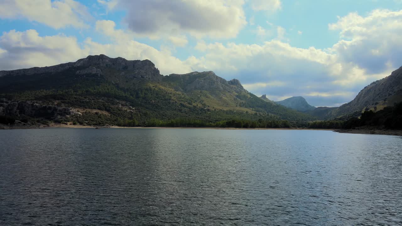 Discover the breathtaking beauty of Gorg Blau, a serene reservoir nestled in the Sierra de Tramuntana mountains of Mallorca. Marvel at the striking landscape and tranquil waters.
