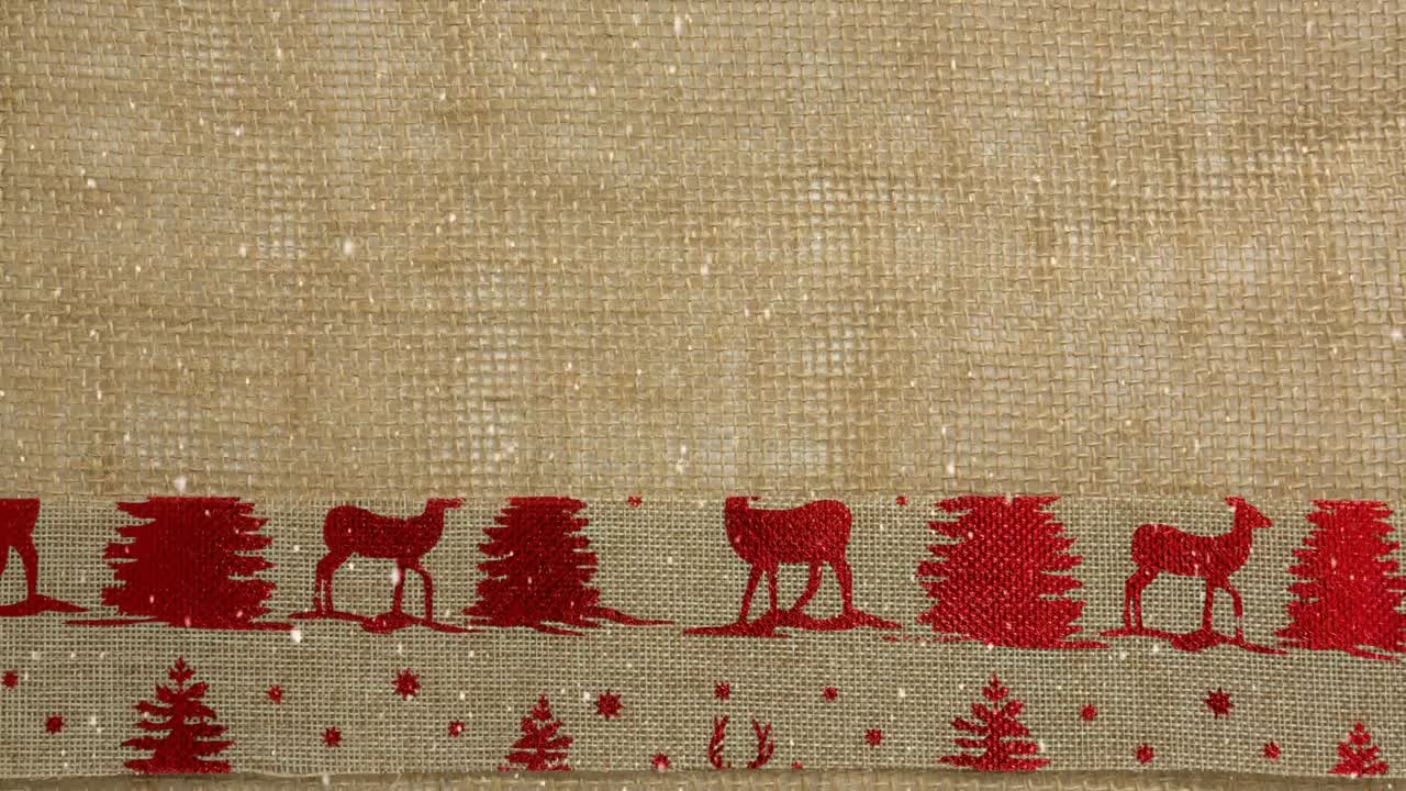 la nieve cayendo con el textil de renos de navidad
