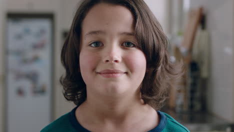 portrait-happy-little-boy-smiling-at-camera-friendly-child-at-home-in-kitchen