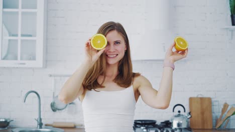 woman with oranges on her eyes