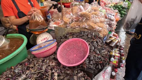 customer buying seafood at a bustling market