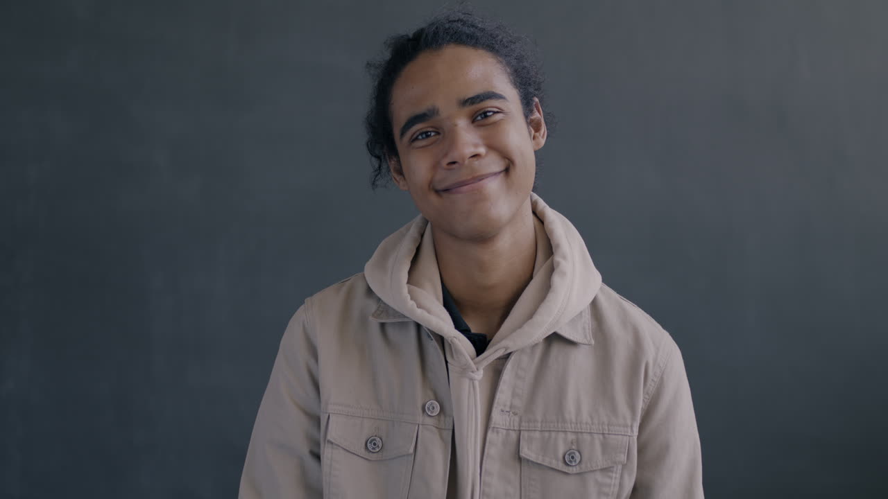 Smiling Teenager with Thumbs Up