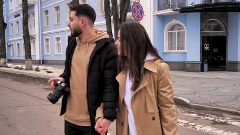 caucasian tourist couple walking through the city.