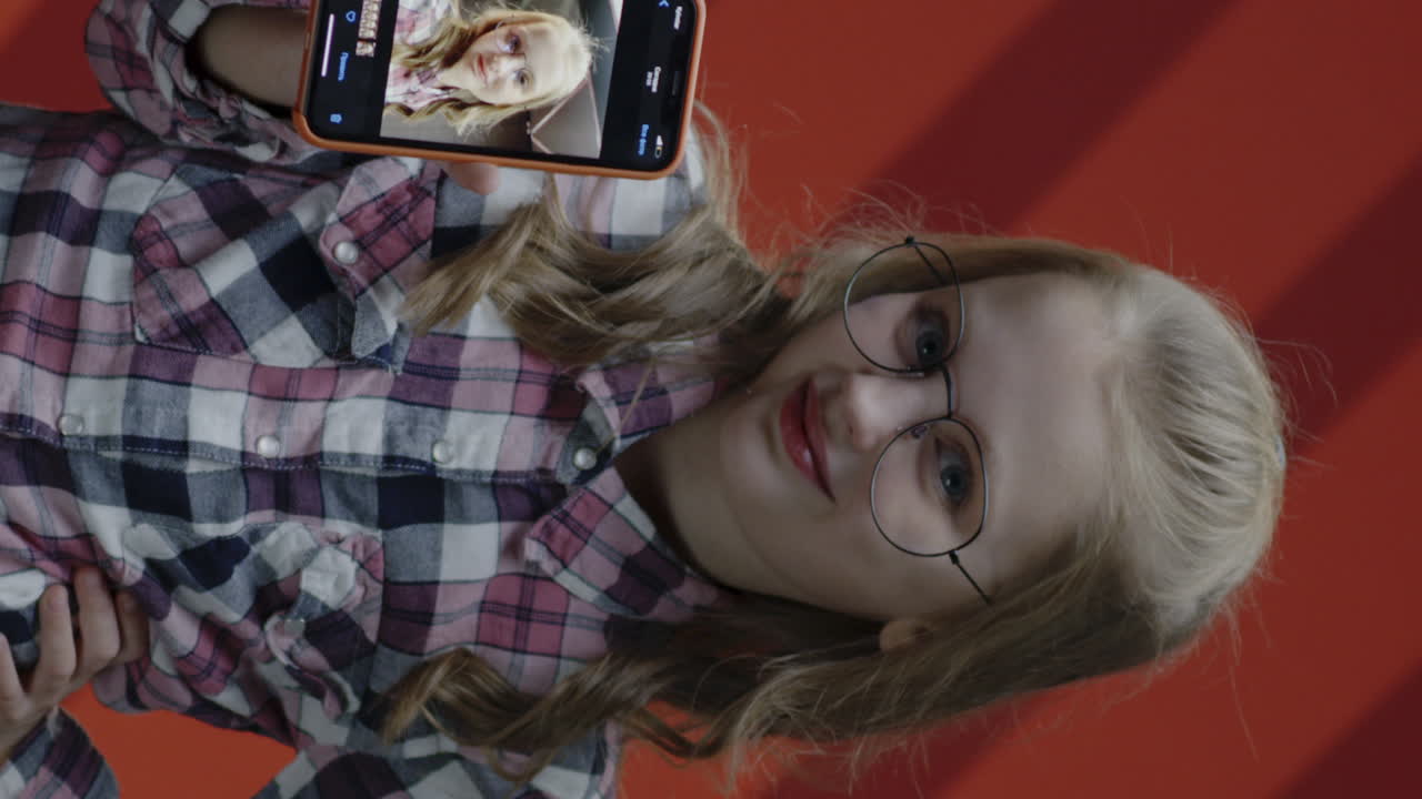 Girl Holding Up Phone Showing Selfie