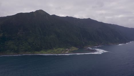 coastal-rural-village,-a-lagoon,-with-lush-green-cliffs-landscape,-FajÃ£-de-Santo-Cristo,-SÃ£o-Jorge-island,-the-Azores,-Portugal