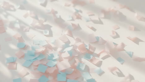 pink and blue confetti scattered with shadows
