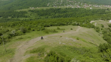 Two-motorcycles-on-an-off-road-cruise-towards-rural-village-in-Georgia