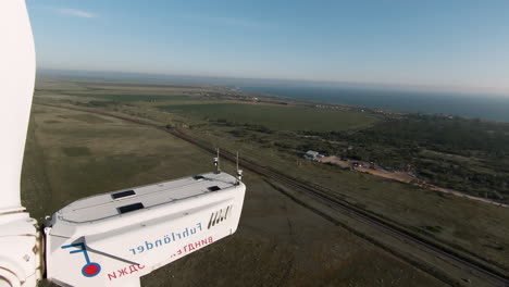 wind turbine with coastal landscape view