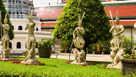 stone statues in temple garden setting