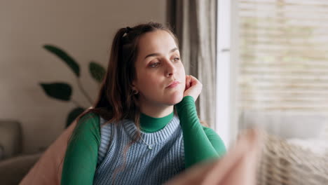 Thinking,-depression-and-young-woman-in-the-living